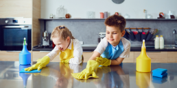 Kids Cleaning A Kitchen