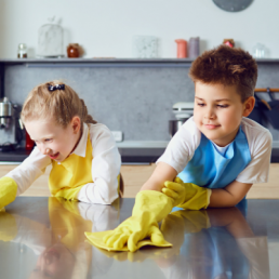 Kids Cleaning A Kitchen