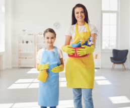 Mother & Daughter Holding Specialised Cleaning Products